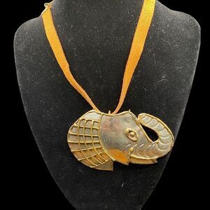 Elephant pendant/brooch combination silver tone with brass trim on brown choker